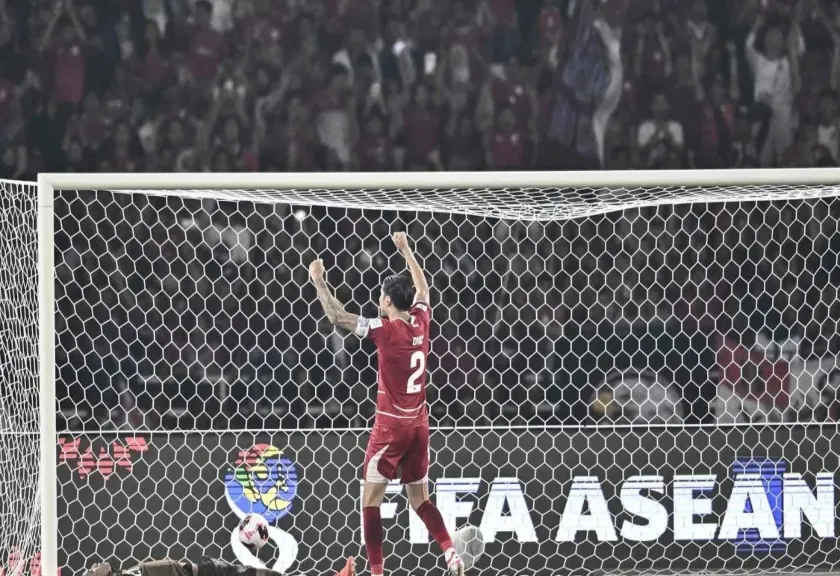 Indonesia National Team captain Kevin Diks celebrates after scoring against Thailand during the penalty shootout in the 2026 FIFA ASEAN Cup final. 